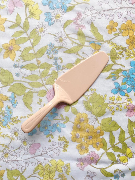 Pelle à tarte en céramique rose